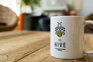 The Hive Logo on Coffee Cup