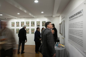 Attendees Perusing Art in The Farm House gallery space